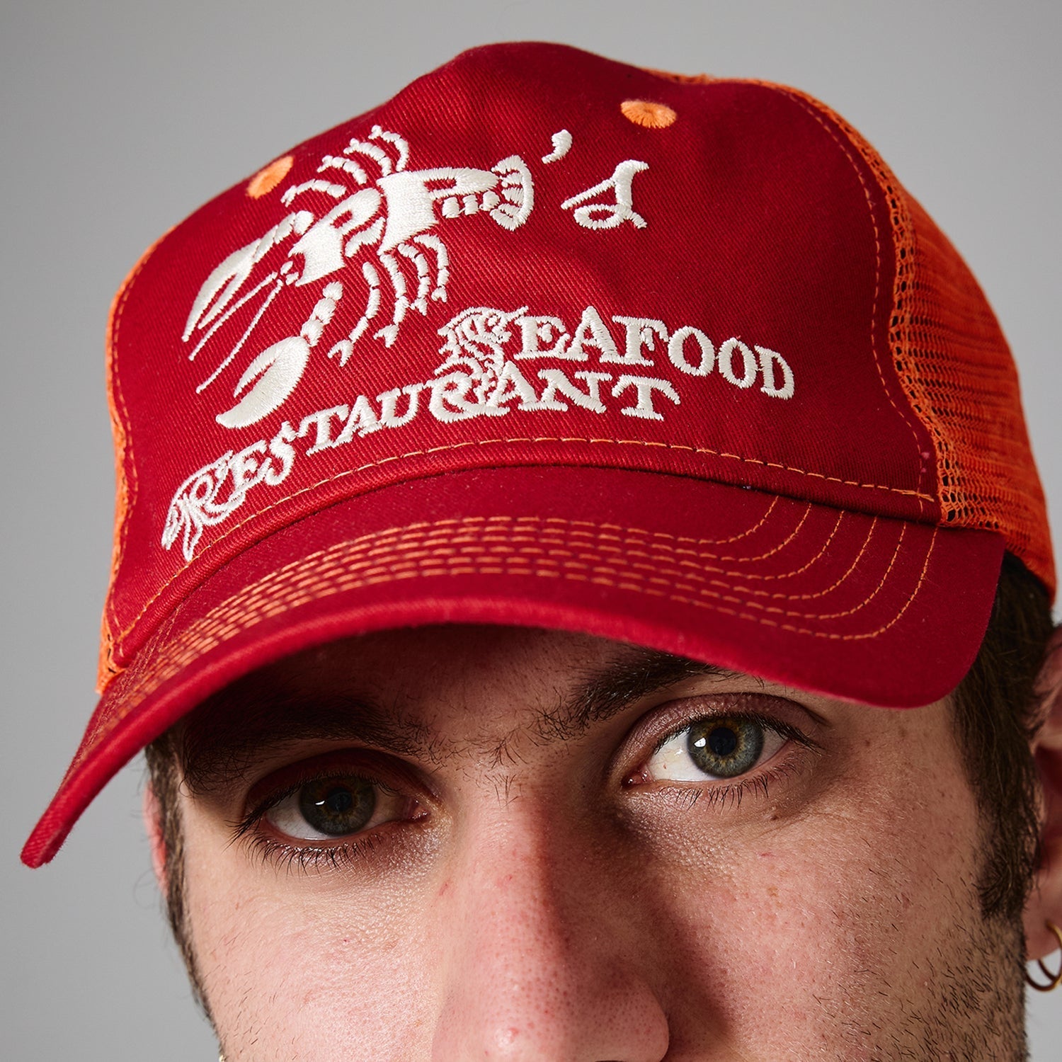 Passport Seafood Staff Packers Trucker Cap